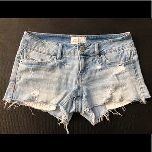 Distressed denim shorts with crochet pockets